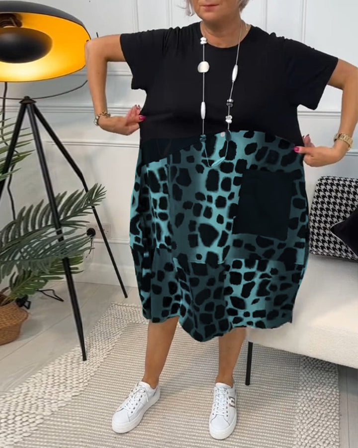 Yvonne - Robe patchwork noire à encolure ronde